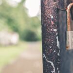 rusted-grey-padlock-in-selective-focus-photography-912005