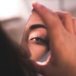 reflection-of-woman-s-eye-on-broken-mirror-2282000