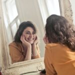 photo-of-woman-looking-at-the-mirror-774866